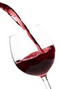 Beautiful splash of red wine in a glass on white background Royalty Free Stock Photo