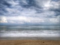 A beautiful splashing swash silky smooth water reflection on beach.