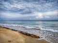 A beautiful splashing swash silky smooth water reflection on beach.