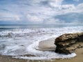 A beautiful splashing swash silky smooth water reflection on beach.