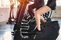 Beautiful sport woman working out on exercise bike at sport health club Royalty Free Stock Photo