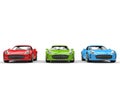 Beautiful sports cars - red, green and blue - front view