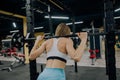 Beautiful sports fitness girl with a barbell. Sporty woman exercising with barbell in gym Royalty Free Stock Photo