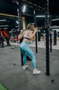 Beautiful sports fitness girl with a barbell. Sporty woman exercising with barbell in gym Royalty Free Stock Photo