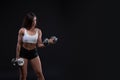 Beautiful sports fitness girl posing on black background Royalty Free Stock Photo