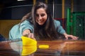 Beautiful sports girl plays air hockey in the entertainment center. Children`s park. Family holiday Royalty Free Stock Photo