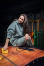 Beautiful sports girl plays air hockey in the entertainment center. Children`s park. Family holiday Royalty Free Stock Photo