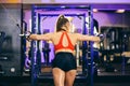 Beautiful sports woman goes in for sports in the gym Royalty Free Stock Photo