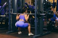 Woman goes in for sports in the gym Royalty Free Stock Photo
