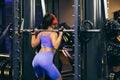 Woman goes in for sports in the gym Royalty Free Stock Photo