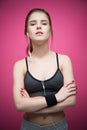 Beautiful sports woman standing with arms folded