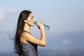 A beautiful sporty caucasian girl drinking water Royalty Free Stock Photo