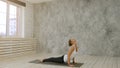 Beautiful sporty fit woman practices yoga asana sun salutation pose Royalty Free Stock Photo