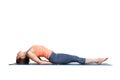 Beautiful sporty fit yogi girl practices yoga asana Matsyasana Royalty Free Stock Photo