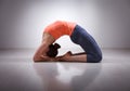 Beautiful sporty fit yogi girl practices yoga