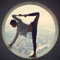 Beautiful sporty fit yogi woman practices yoga asana Natarajasana - Lord Of The Dance pose in a round window at sunset Royalty Free Stock Photo