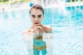Beautiful sexy girl relaxing in a pool at summer Royalty Free Stock Photo