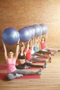 Beautiful sporty girls are exercising with equipment Royalty Free Stock Photo