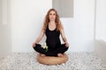 Beautiful Sporty Pregnant Woman sitting on floor meditating or doing pilates exercises in spa. Yoga, fitness Royalty Free Stock Photo