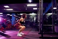 Beautiful sporty sexy woman doing squat workout in gym Royalty Free Stock Photo
