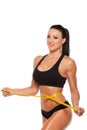 Beautiful sporty woman body with yellow measure on Royalty Free Stock Photo