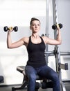 Beautiful sporty woman doing power fitness exercise at sport gym Royalty Free Stock Photo