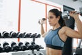 Beautiful sporty woman doing power fitness exercise at sport gym. Royalty Free Stock Photo