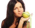 Beautiful sporty woman with green apple and measuring tape Royalty Free Stock Photo