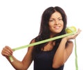 Beautiful sporty woman with green apple and measuring tape Royalty Free Stock Photo