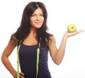 Beautiful sporty woman with green apple and measuring tape Royalty Free Stock Photo