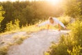 Beautiful sporty woman performing Firefly pose. Girl doing advanced yoga exercises, leaning on hands Royalty Free Stock Photo