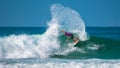 Beautiful spray by the Caucasian male surfer in Red Bull ride my wave championship.