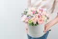 Beautiful spring bouquet in round box. Arrangement with various flowers. The concept of a flower shop. A set of photos Royalty Free Stock Photo