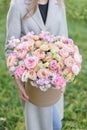 Beautiful spring bouquet in round box. Arrangement with various flowers. The concept of a flower shop. A set of photos Royalty Free Stock Photo