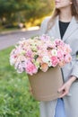 Beautiful spring bouquet in round box. Arrangement with various flowers. The concept of a flower shop. A set of photos Royalty Free Stock Photo