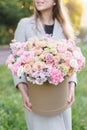 Beautiful spring bouquet in round box. Arrangement with various flowers. The concept of a flower shop. A set of photos Royalty Free Stock Photo