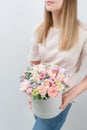 Beautiful spring bouquet in round box. Arrangement with various flowers. The concept of a flower shop. A set of photos Royalty Free Stock Photo