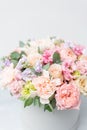 Beautiful spring bouquet in round box. Arrangement with various flowers. The concept of a flower shop. A set of photos Royalty Free Stock Photo