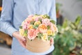 Beautiful spring bouquet in round box. Arrangement with various flowers. The concept of a flower shop. A set of photos Royalty Free Stock Photo