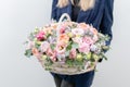 Beautiful spring bouquet in wicker basket. Arrangement with various flowers. The concept of a flower shop. A set of Royalty Free Stock Photo