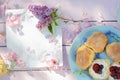Beautiful spring breakfast background with Scottish scones, lilac and cherry flowers