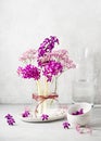 Beautiful spring floristic arrangement with purple hyacinth, and pink gypsophila flowers in a glass vase. Royalty Free Stock Photo