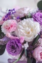 Beautiful spring Flowers in bouquet in pink and purpl color. Arrangement with Peonies roses. Flowers decor.