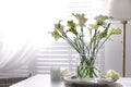 Spring freesia flowers on table in room Royalty Free Stock Photo