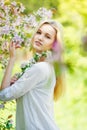 Beautiful spring girl in blooming tree