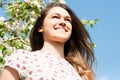 Beautiful spring girl in blooming tree relaxing outside in nature Royalty Free Stock Photo