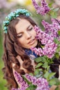 Beautiful spring girl in lilac flowers Royalty Free Stock Photo