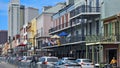 a beautiful spring landscape along Decatur Street with people walking, skyscrapers and office buildings in the skyline and cars