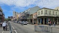 a beautiful spring landscape along Decatur Street with people walking, skyscrapers and office buildings in the skyline and cars