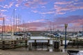 a beautiful spring landscape at Fisherman\'s Wharf on Pier 39 with boats and yachts docked in the harbor with ocean water Royalty Free Stock Photo